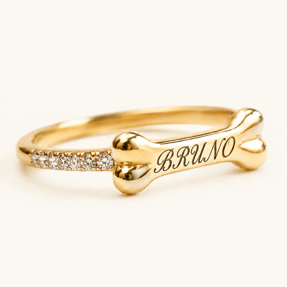 Goldener personalisierter Knochenring mit Wunschname BRUNO und Zirkonia – Treuespur